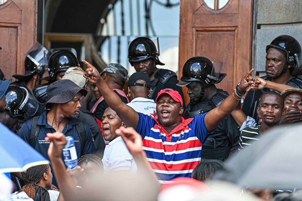 Chairperson of the University of the Free State student council, Pfarelo Maphangula, addresses students in front of the main building, 11 February 2025, South Africa. The group is demanding that students who owe money should be allowed to attend classes. Chairperson of the University of the Free State student council, Pfarelo Maphangula, addresses students in front of the main building, 11 February 2025, South Africa. The group is demanding that students who owe money should be allowed to attend classes.