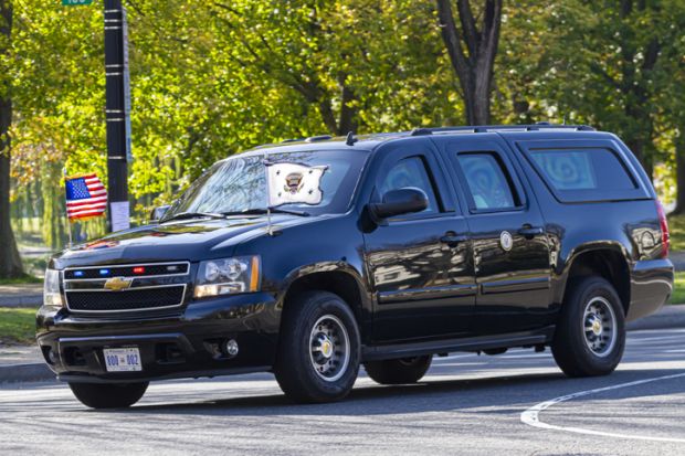 Washington DC, USA 11-06-2020 Armor plated Chevrolet Suburban with US presidential seal and 800 002 license plate used by presidential motorcade is cruising in Constitution Avenue near White House.