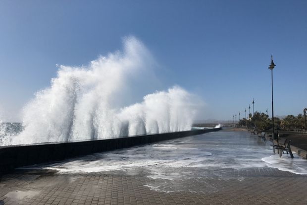 Giant waves hit the sea wall