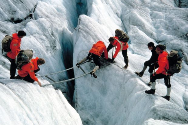 A group navigating a crevasse in Norway A group navigating a crevasse in Norway to illustrate Norway budget: students given more support but research funds cut