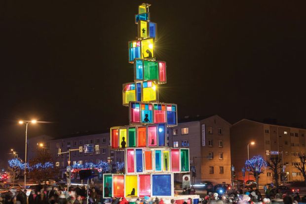  Christmas tree constructed of 121 old windows that come from local old houses is illuminated in Rakvere, Eastern Estonia to illustrate Is the university really a community?