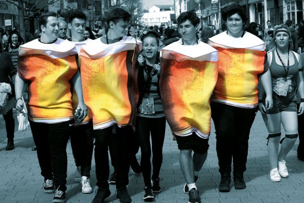 Chichester University's charity pub crawl group dressed in larger outfits for a metaphor for As freshers make up for forgone alcohol experiments during lockdown