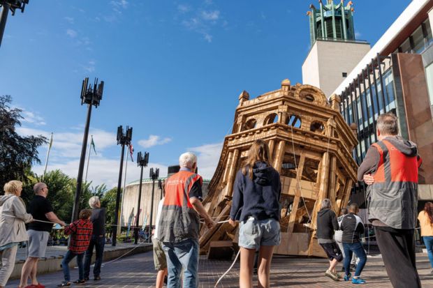 Volunteers help with the demolition of the 'Monumental Construction' - a 45ft (14 metre) cardboard building created by French visual artist Olivier Grossetete to illustrate Top UK laboratories adjust as Wellcome Trust cuts core funding
