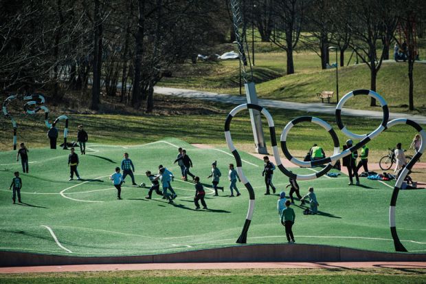 Children play on The 'Puckelboll' pitch, a distorted artificial grass pitch for football, where the pitch halves and objectives are of different sizes and where the artificial turf is bumpy,  to illustrate Swedish funding overhaul devalues basic research