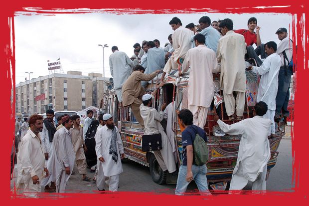 Pakistani commuters climb on a crowded public transport vehicle in Karachi Pakistani commuters climb on a crowded public transport vehicle in Karachi, to illustrate 'State of emergency'