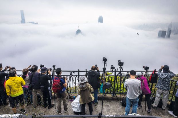  People take photographs of fog over Hong Kong  to illustrate HKU faculty blame a ‘culture of opacity’ as v-c denies misconduct