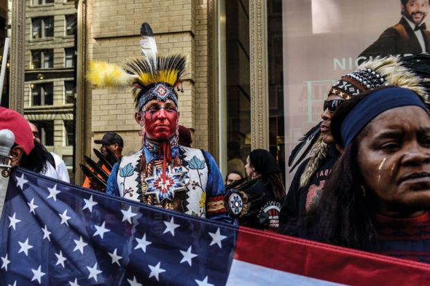 Native peoples participate in the first annual Indigenous Peoples of the Americas parade to illustrate US pushes integration of indigenous knowledge in science