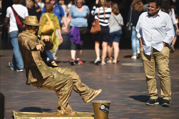 A street artist performs for the public in Sydney