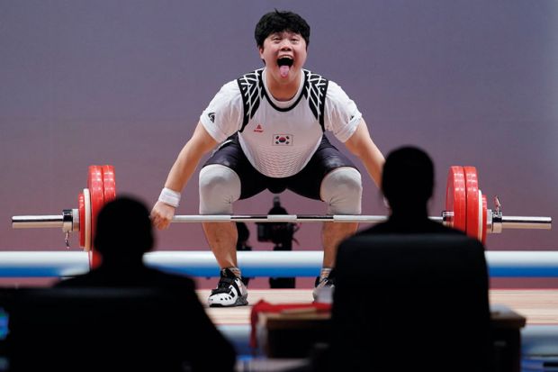  Han Junghoon of South Korea competes in the men's 96kg weightlifting to illustrate Korean universities poised to abandon 14-year tuition fee freeze