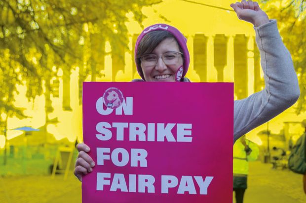 Person on a protest against payments and pensions as more than 70,000 university staff are on strike in the UK Person on a protest against payments and pensions as more than 70,000 university staff are on strike in the UK