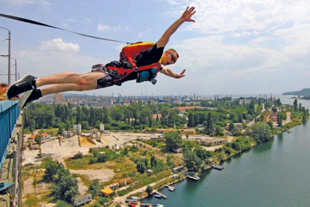 BASE jumper jumps using a packed parachute from the only 52 meters altitude Asparuhov bridge durung to illustrate Hostility on Horizon for next European research commissioner