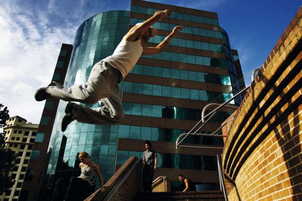 Person exhibits Le Parkour, in Sydney to illustrate New Australian workforce agency to target graduate shortage areas