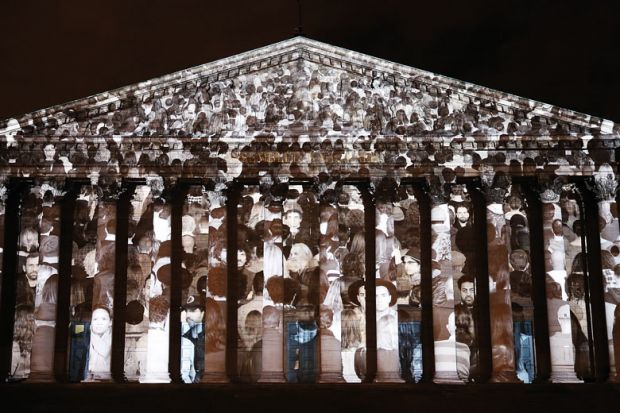 "The Standing March" a Public Artwork By Artist JR and Filmmaker Darren Aronofskyis projected on the facade of the French parliament at Assemblee Nationale to illustrate No amount of technology can replicate the magic of in-person conferences