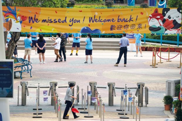 A banner reading 'We missed you! Welcome back!' hangs at the entrance of Hong Kong Ocean Park to illustrate Hong Kong moving beyond pandemic and protests, says v-c