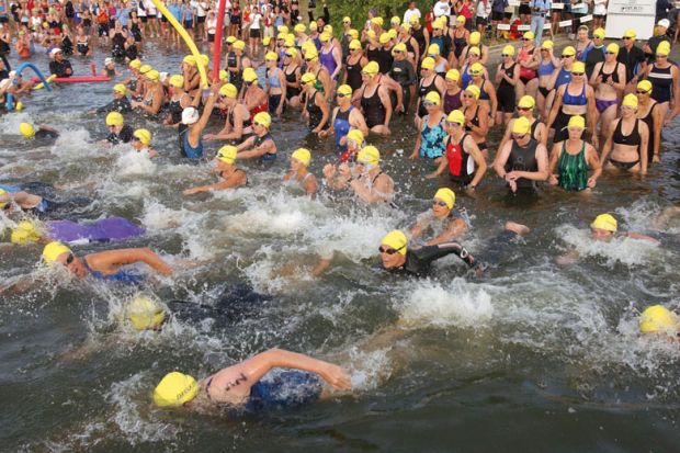 Over 2,300 people swim out to the sea as they take part in the Danskin Women's Triathlon Series to illustrate Mass resignations from diamond journal over £2,500 author fees