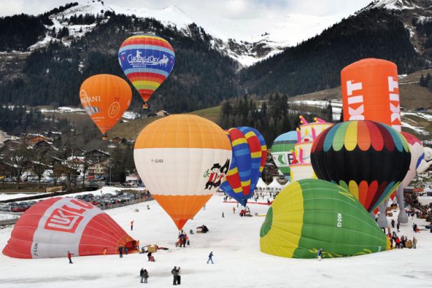 Hot air balloons take off in the Swiss Alps to illustrate Squeezed Swiss weigh EU alliances against global mobility