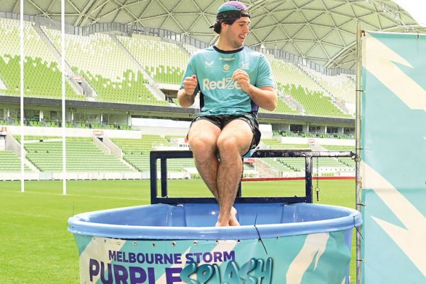 Cole Geyer of the Storm is on the dunking machine in Melbourne, Australia to illustrate NSW universities plunge into the red as finance markets turn