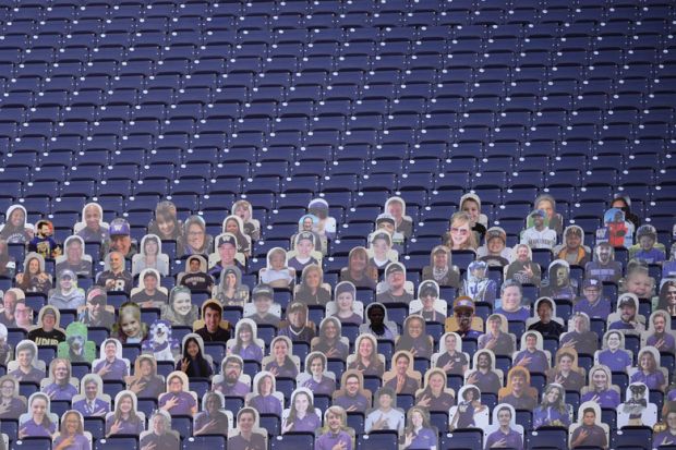 Empty stadium seats are seen with only card board cut outs of fans to illustrate The US has the scope to benefit greatly fro m overseas students
