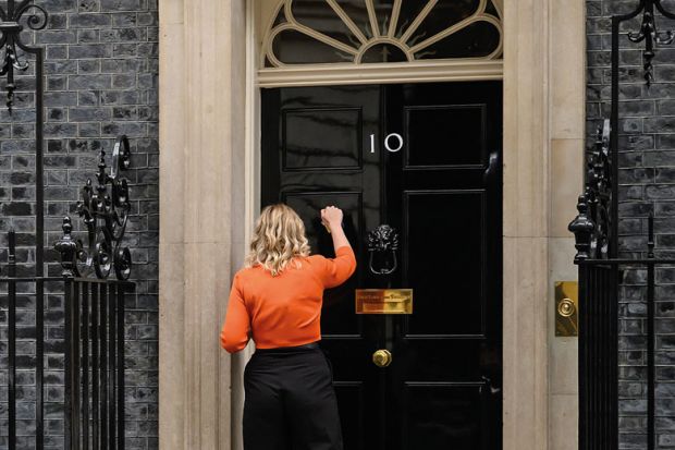 A woman knocks on the door of number 10 to illustrate Crisis communications