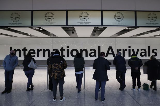  People wait at the international arrivals gate to illustrate Plan to limit overseas student recruitment ‘driven by No 10’