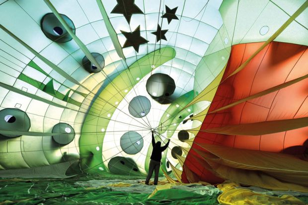 Hot air balloon expanding while being inflated to illustrate UK master’s students less satisfied after rapid sector expansion