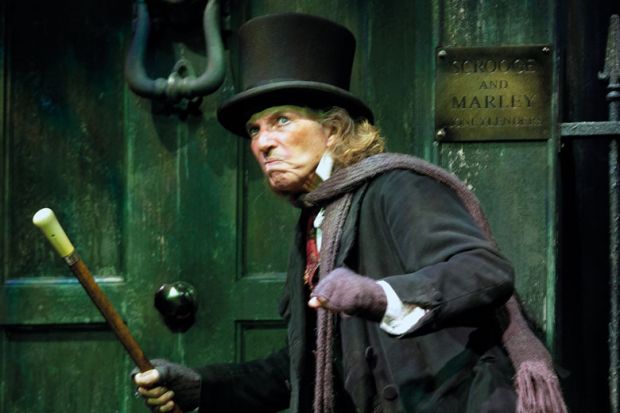 Tommy Steele (as Scrooge) in the production Scrooge to illustrate Most universities in marking boycott threaten to dock full pay