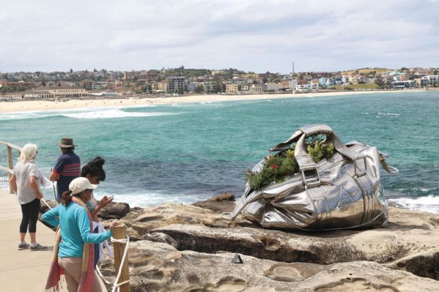Stainless steel Bag sculpture by artist Yumin Jing at Sydney, Australia to illustrate Disadvantaged students cost ‘six times as much to teach’