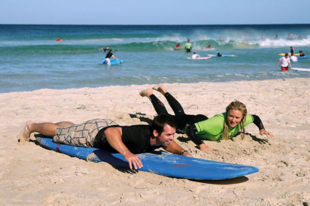  Person given a surfing lesson to illustrate Tuition fee review ‘must go back to first principles’
