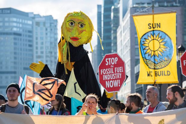 Climate activists from the group Extinction Rebellion in Massachusetts as the article describes how it plans to improve climate change