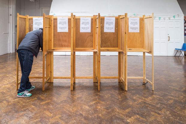 One person in empty line of voting booths to illustrate UK scholars’ strike fatigue leaves union facing uncertain path