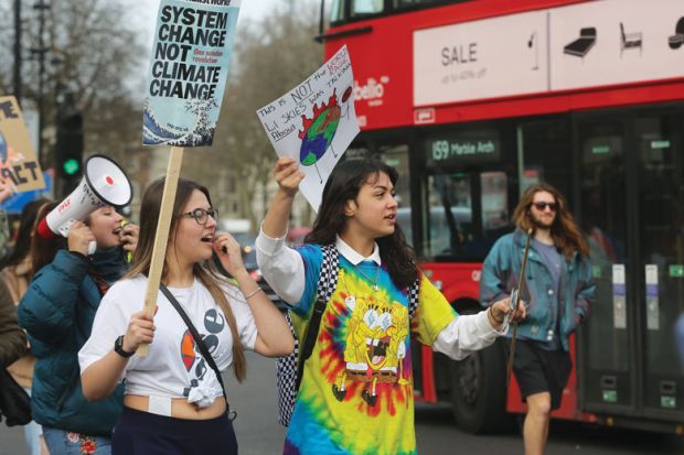  Students stage climate change demonstration around the Houses of Parliament in central London, to illustrate embed climate change education into all degrees, academics urge
