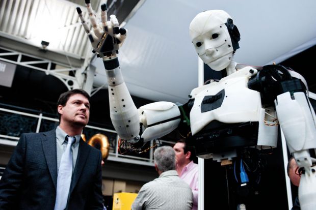 A humanoid robot on show to illustrate Funders mull robot reviewers for REF