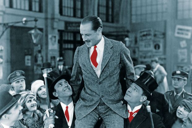 Man carried on shoulders above crowd Man carried on shoulders above crowd to illustrate Who’s a jolly good fellow?