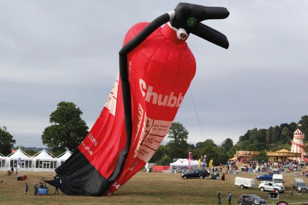 Balloon of a  fire extinguisher deflating at the Bristol International Balloon Fiesta to illustrate Top departments face cuts under ‘unnoticed’ REF funding shift