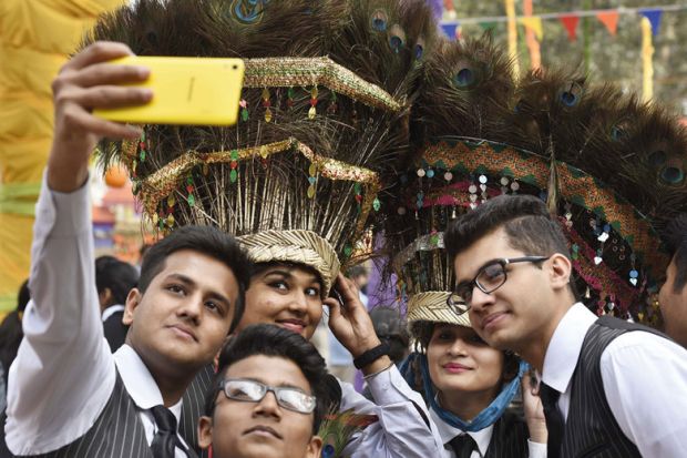 Students taking a photo during a press preview of the 30th International Surajkund Art Crafts Mela at Surajkund to illustrate Indian states blacklisted as Australian visa rejections soar
