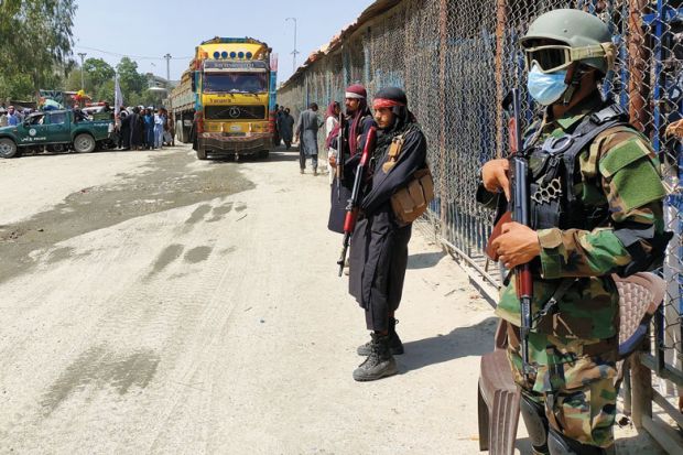 Taliban and Pakistani security guards at the Torkham border crossing Taliban and Pakistani security guards at the Torkham border crossing as a metaphor for Get at-risk research collaborators out of Afghanistan, UK told