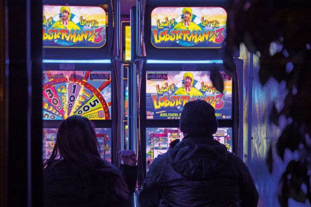 People playing slot machines in Iceland to illustrate Iceland university ‘hooked on slot machine income’