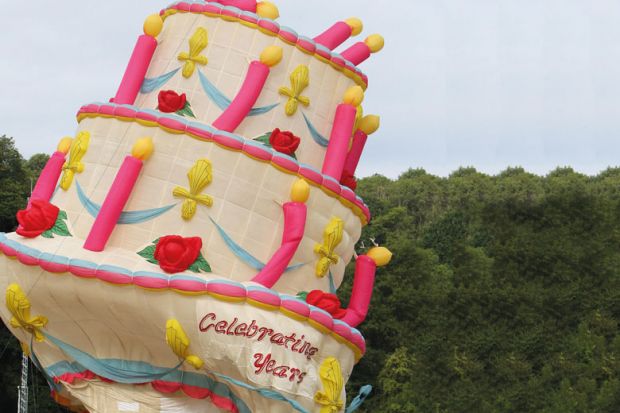 Deflated hot air balloon in the shape of a birthday cake at the 40th annual Bristol International Balloon Fiesta to illustrate Doubts over future of science department if Labour wins election