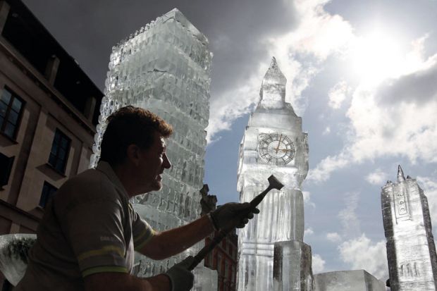 British ice sculptor Duncan Hamilton carves out ice from his sculpture of London's iconic Big Ben to illustrate Graduate visa review ‘can’t be allowed to threaten its existence’
