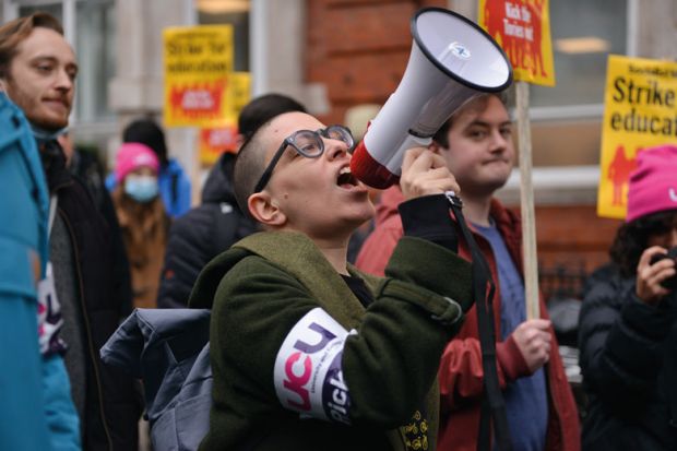 A protester speaks through a megaphone during the demonstration to illustrate  Can UCU get the vote out for sector-wide UK strike?