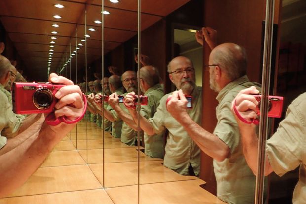 Person taking a selfie in a mirror to illustrate Journal editors’ ‘selfies’ queried