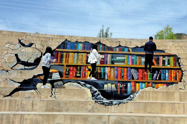 Students who learn fine arts paint a 'library' with 3D design on stairways at Lanzhou University to illustrate China looks to universities to lead development of its mid-west