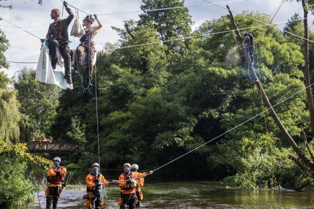 People sitting on a line above the river Colne seeking to protect an ancient alder tree with ree surgeons working to cut the trees down to illustrate European partners ‘won’t hold grudges’ despite Horizon impasse