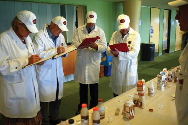 Judges at the Sydney Royal Cheese and Dairy Produce Show assess flavoured milk products