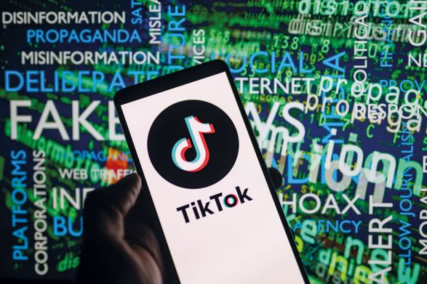 TikTok icon logo displayed on a smartphone with disinformation on screen  in the background to illustrate Students are ‘learning’ about Israel-Hamas from TikTok. We must step up
