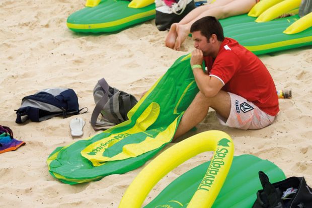 Person with deflated lilo at Bondi Beach, Sydney to illustrate Appetite for master’s study stays sluggish in Australia
