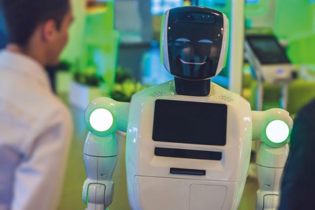 Man talking with a robot to illustrate ChatGPT assessed as ‘powerful tool for education if used correctly’