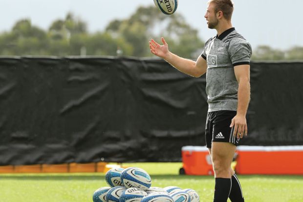 Braydon Ennor of the All Blacks throws a ball into the air chosen from a pile of balls on the ground  to illustrate Vice-chancellors ‘should be university community’s choice’ 