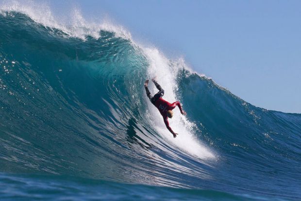  surfer falling from a wave to illustrate Top universities’ overseas income boost wiped out by inflation