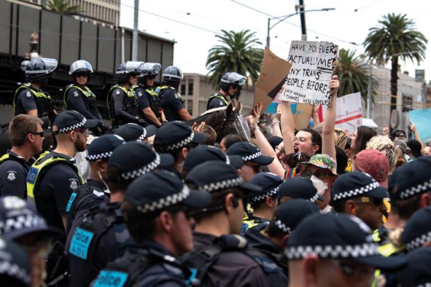 Police hold back counter-protesters at a Trans Exclusionary Radical Feminist (TERF) rally from event  as described in the article